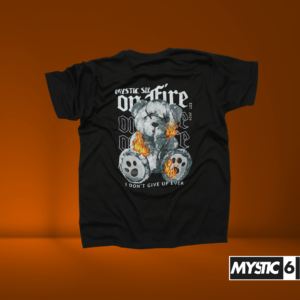 Mystic Six black T-shirt featuring a graphic of a teddy bear with its paws on fire, accompanied by bold text "On Fire" and the phrase "I Don't Give Up Ever."