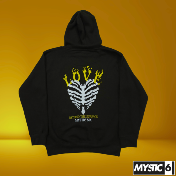 Mystic Six black hoodie featuring a ribcage skeleton design with the word "LOVE" in yellow and white, and the text "Beyond the Surface" underneath.